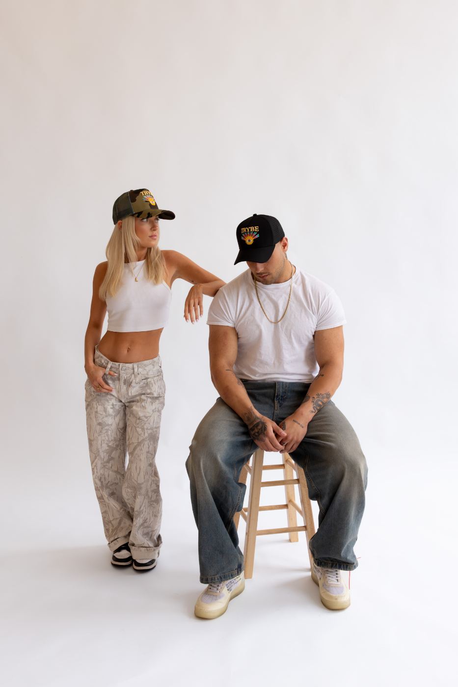 Trybe Onyx Sunburst two-tone trucker hat — premium structured snapback with evil eye embroidery